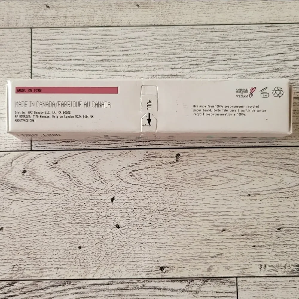 About Face Light Lock Lip Gloss in Angel on Fire